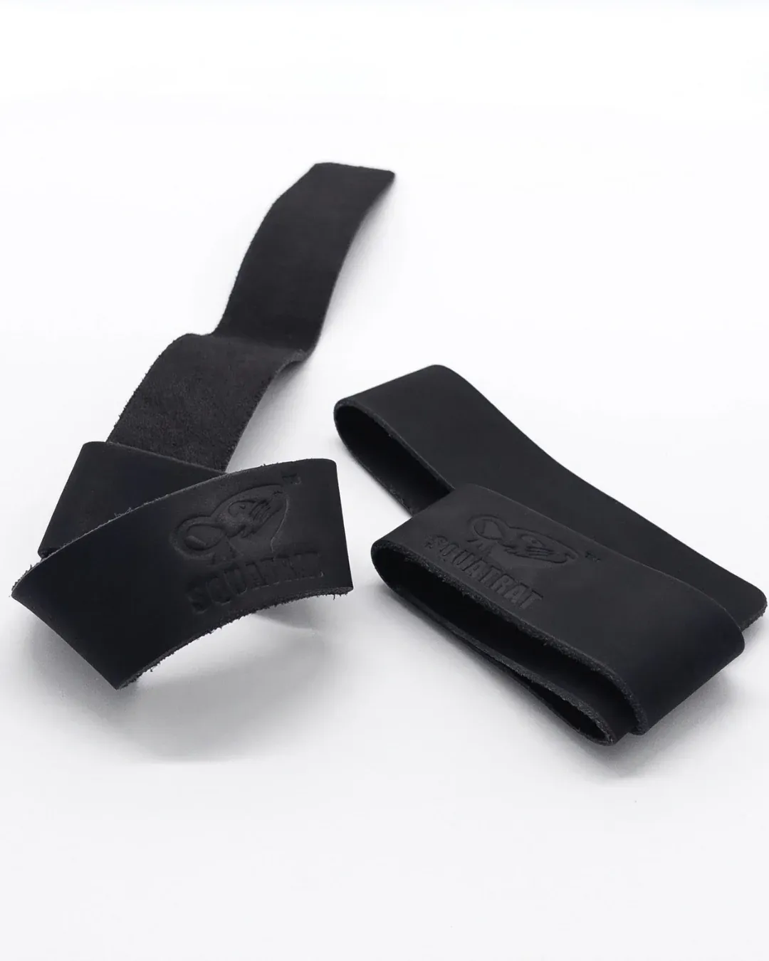 SQUATRAT suede leather lifting straps, black pair arranged in loops with embossed logos visible.